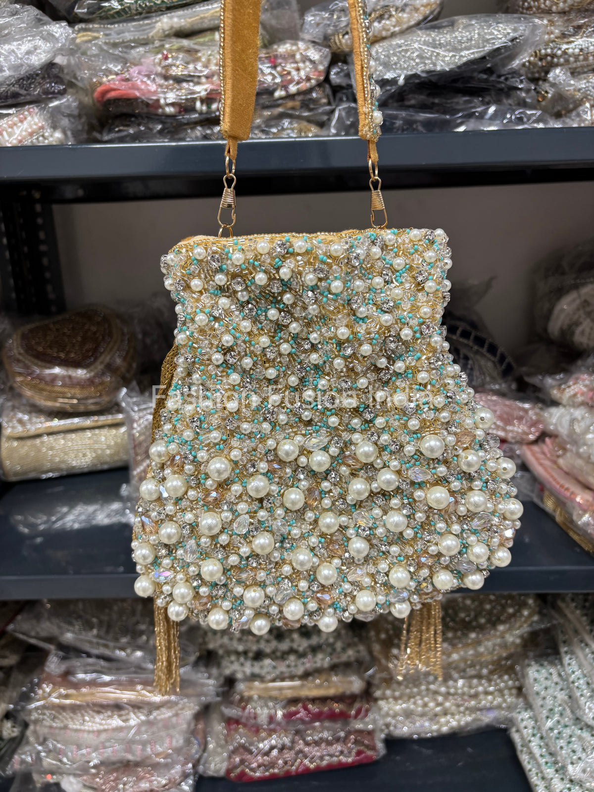 Beaded handbag with pearls on a blurred background