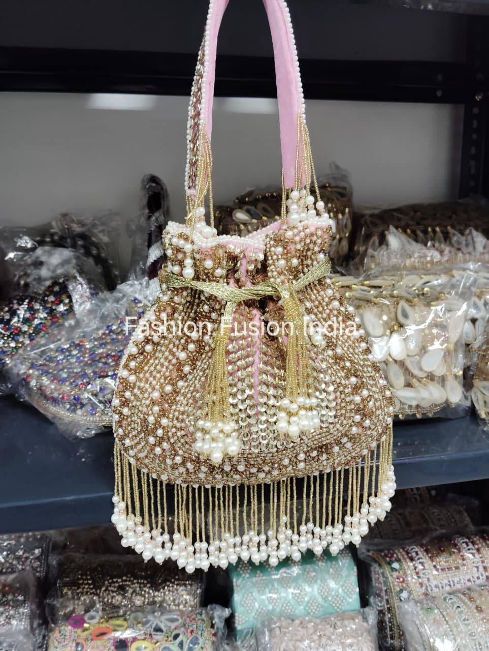 Decorative handbag with pearls and beads on a blurred background