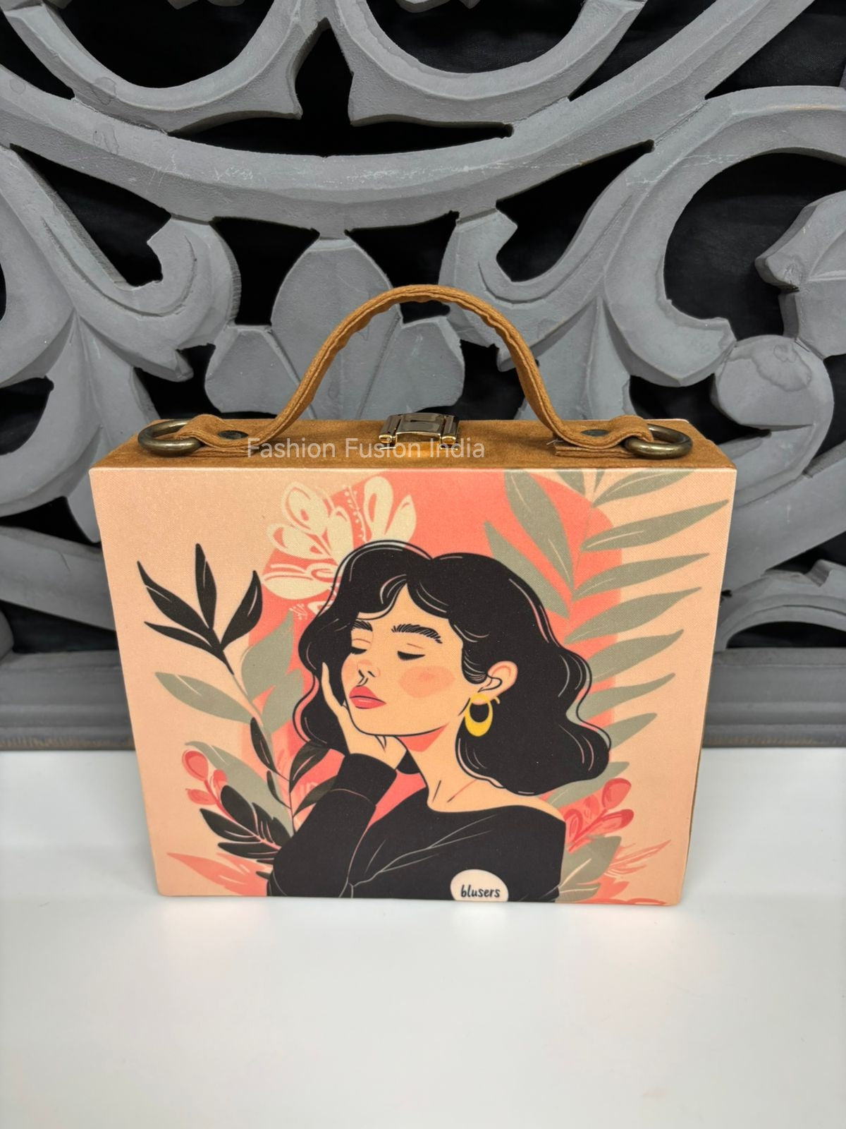 Modern illustrated wooden clutch bag with floral female artwork against carved grey backdrop.