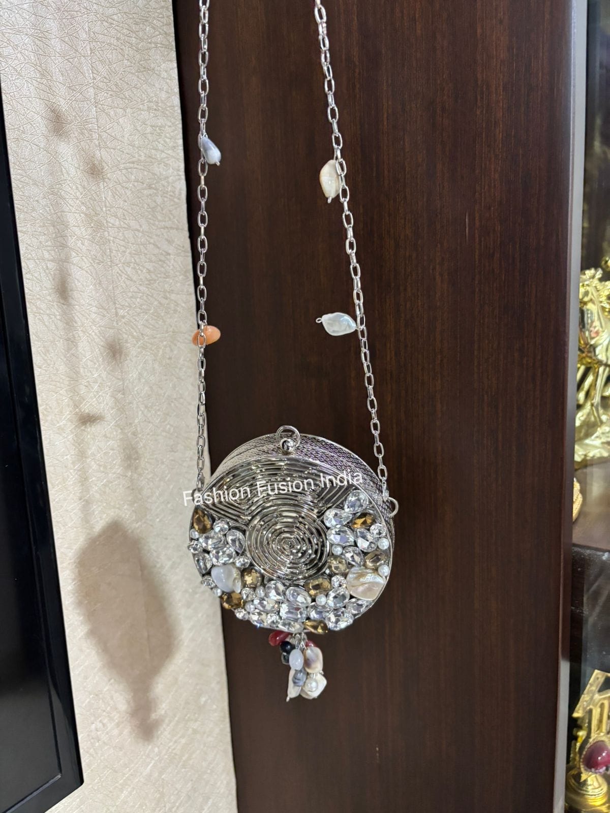 Decorative necklace with intricate design on a wooden surface