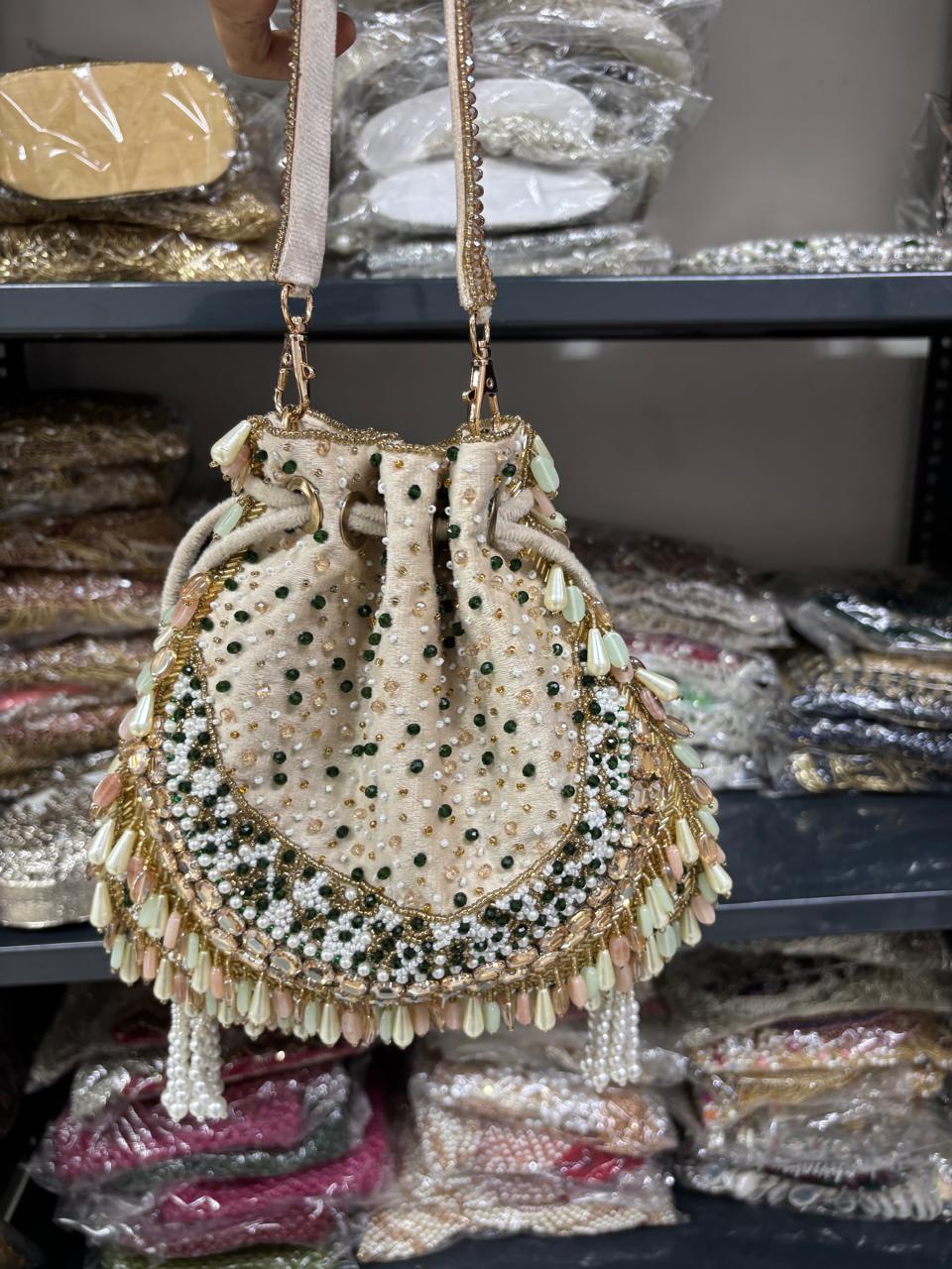 Decorative handbag with beads and tassels in a store setting