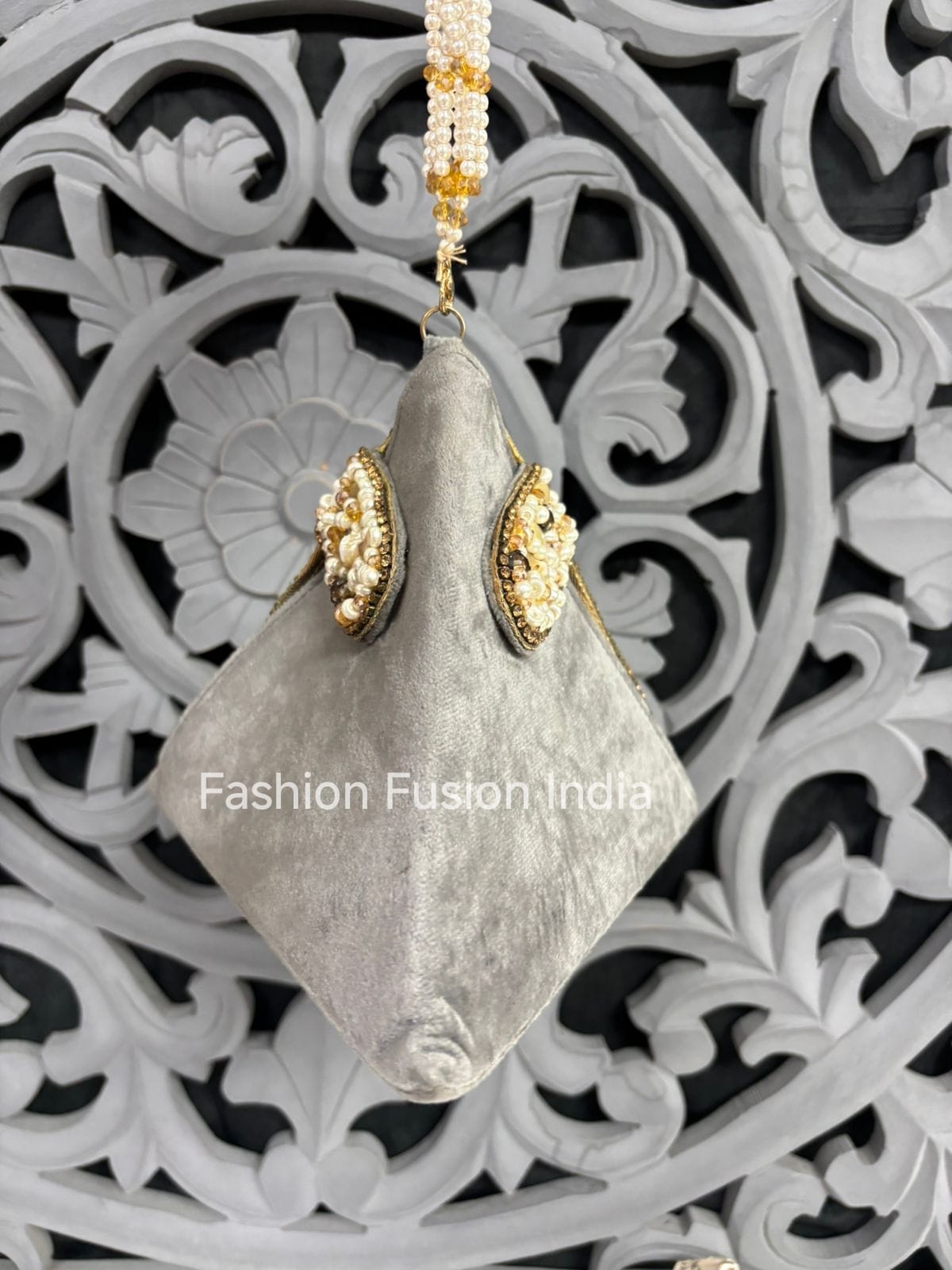 Decorative earrings with gold accents on a white background