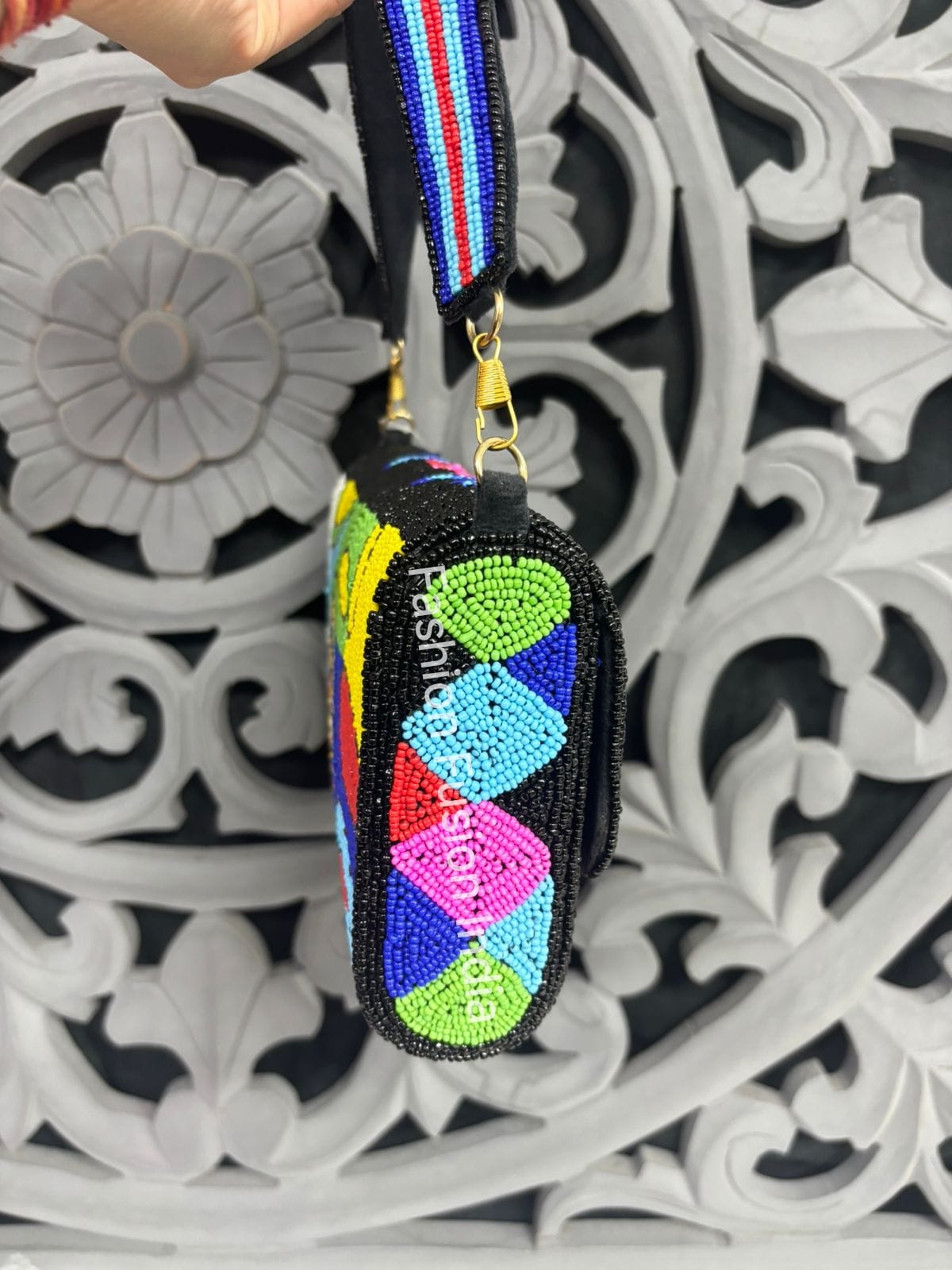 Colorful embroidered keychain with a decorative background