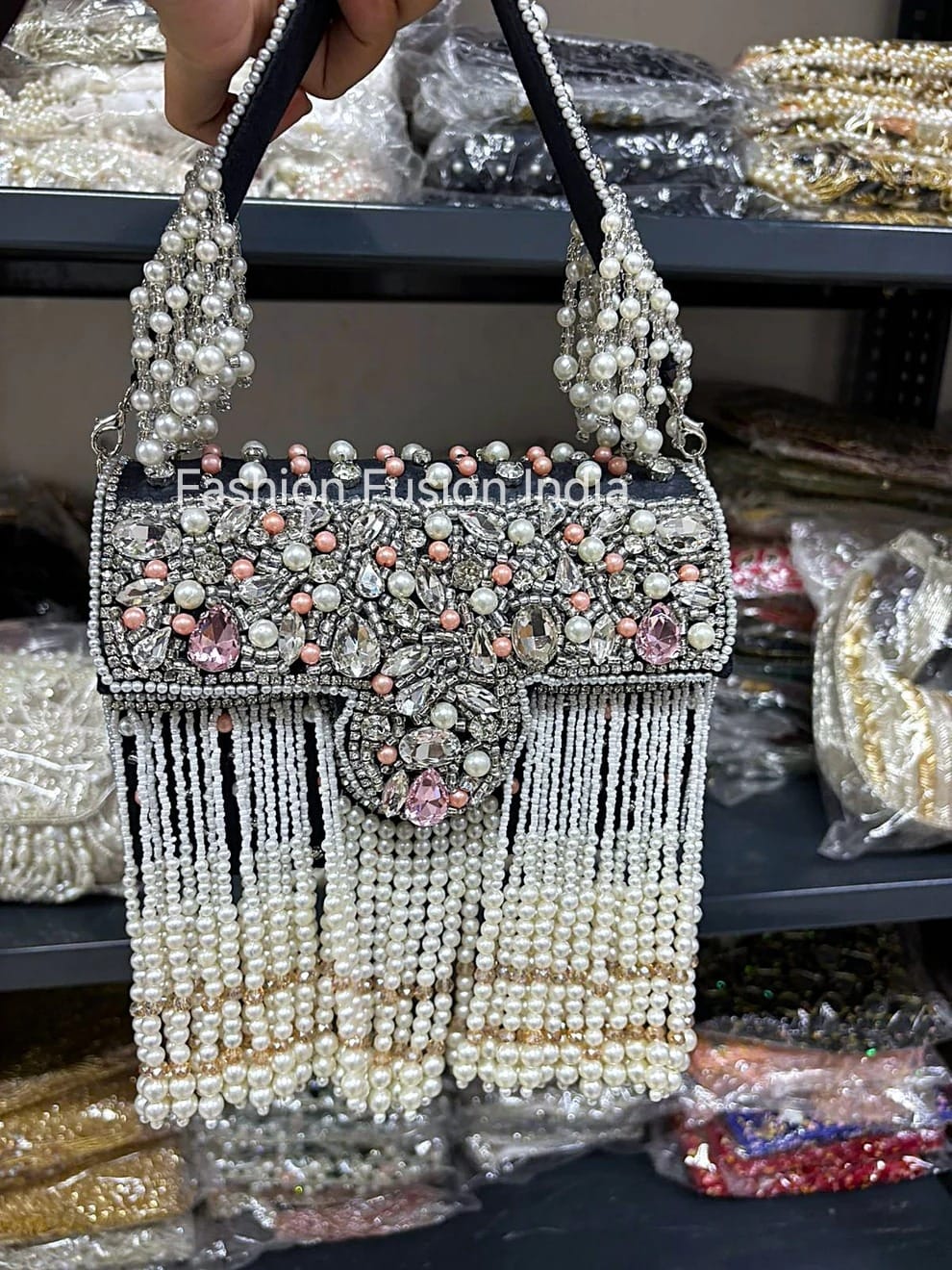 Decorative handbag with pearls and beads in a store setting