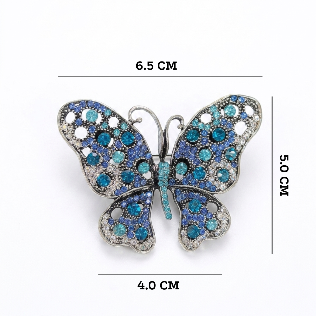 Blue butterfly brooch with measurements on a white background