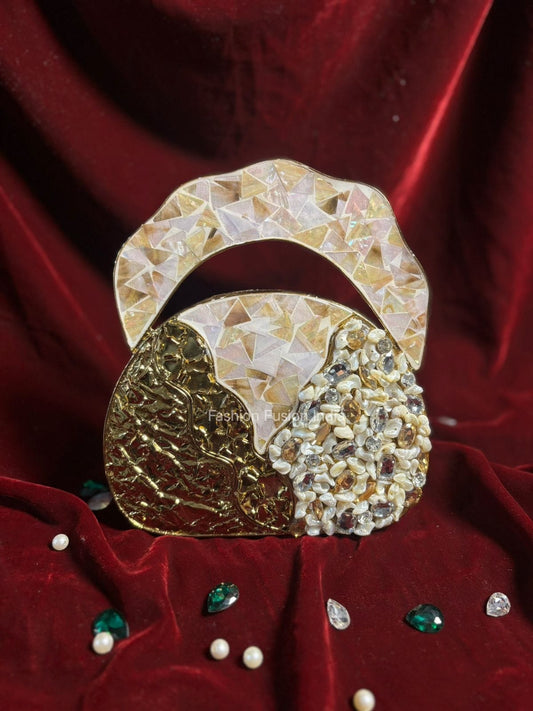 Decorative brooch with gold and pearl design on a red fabric background