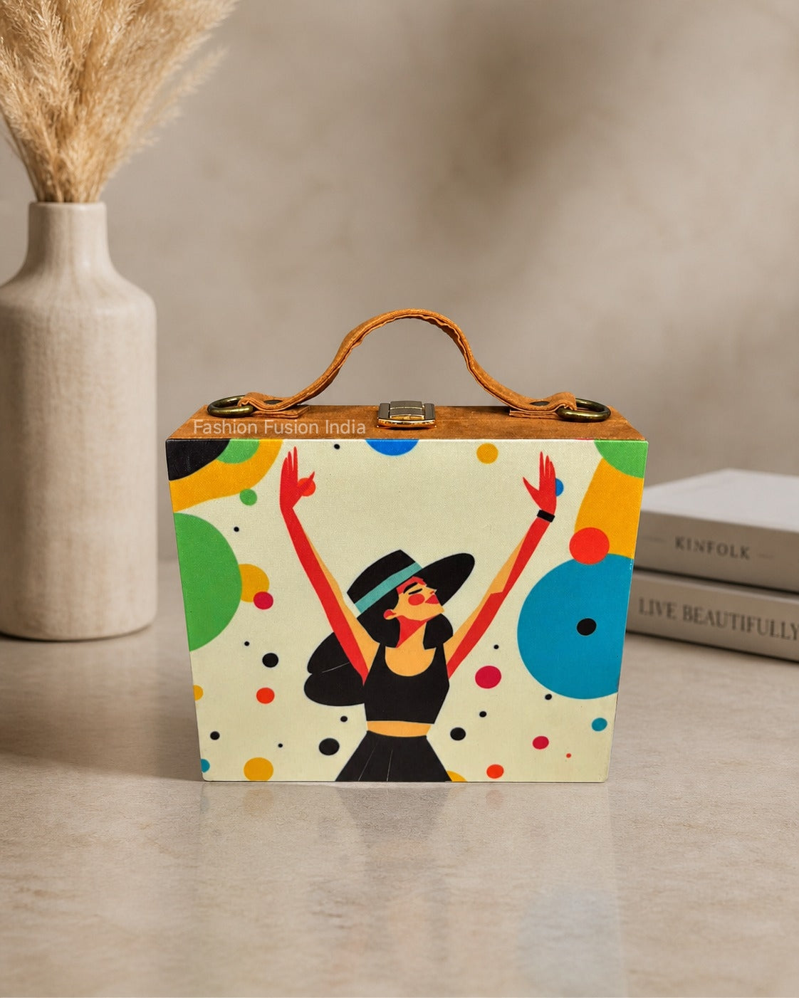 Artistic wooden clutch bag with colorful abstract woman print on beige décor background.