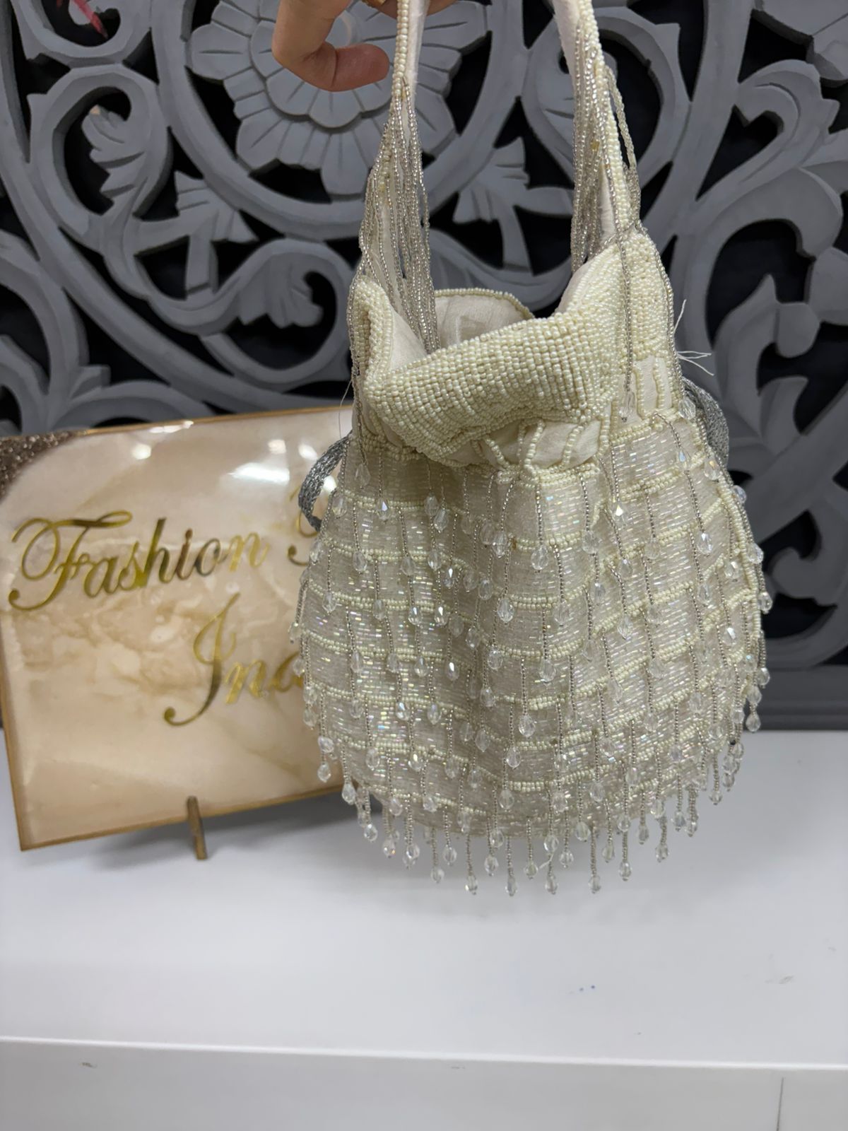 Beaded handbag with decorative background