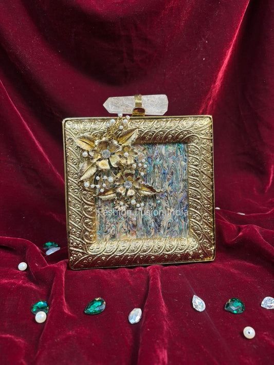 Decorative gold box with floral design on a red velvet background