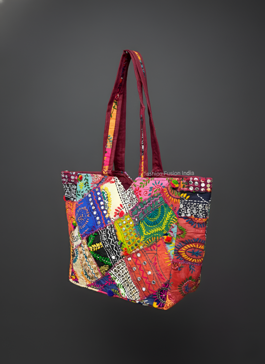 Colorful embroidered handbag with intricate patterns on a gray background