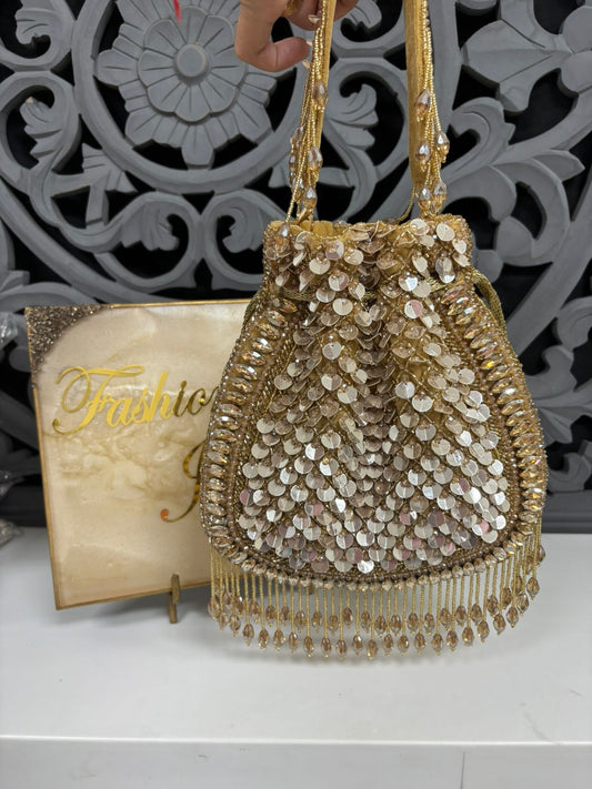 Gold beaded handbag with decorative background