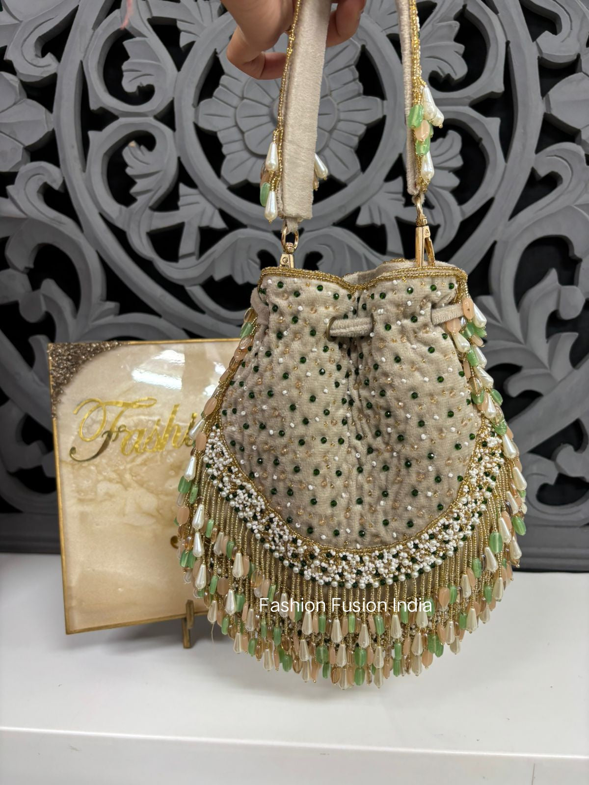 Golden Potli Bag with green and White Embroidery
