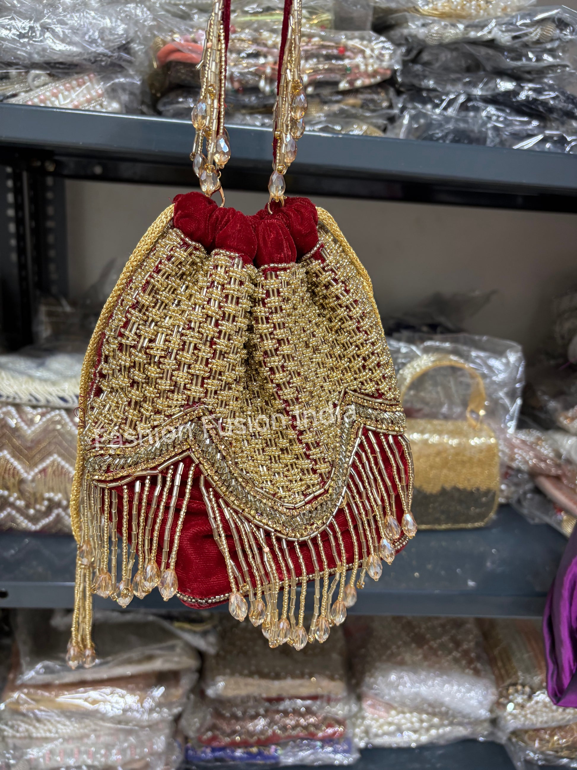 Decorative handbag with gold and red details on a blurred background