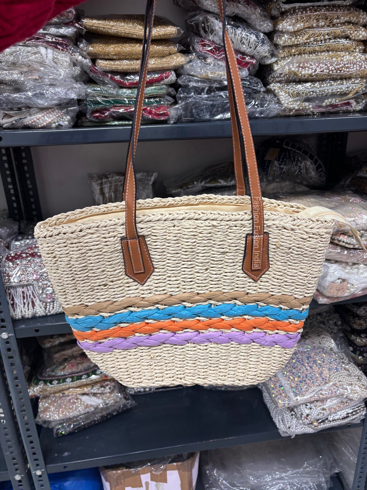 Woven handbag with colorful stripes on a shelf in a store