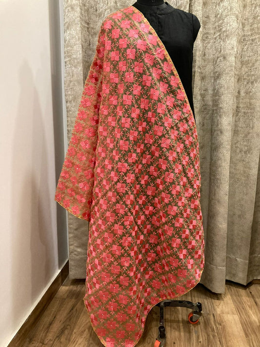 Floral patterned fabric draped over a mannequin against a neutral background