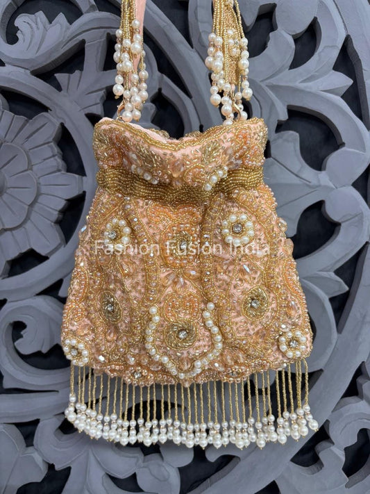 Decorative handbag with pearls and beads on a decorative background