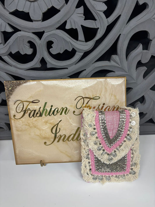 Decorative clutch bag with intricate designs next to a 'Fashion Indian' sign.