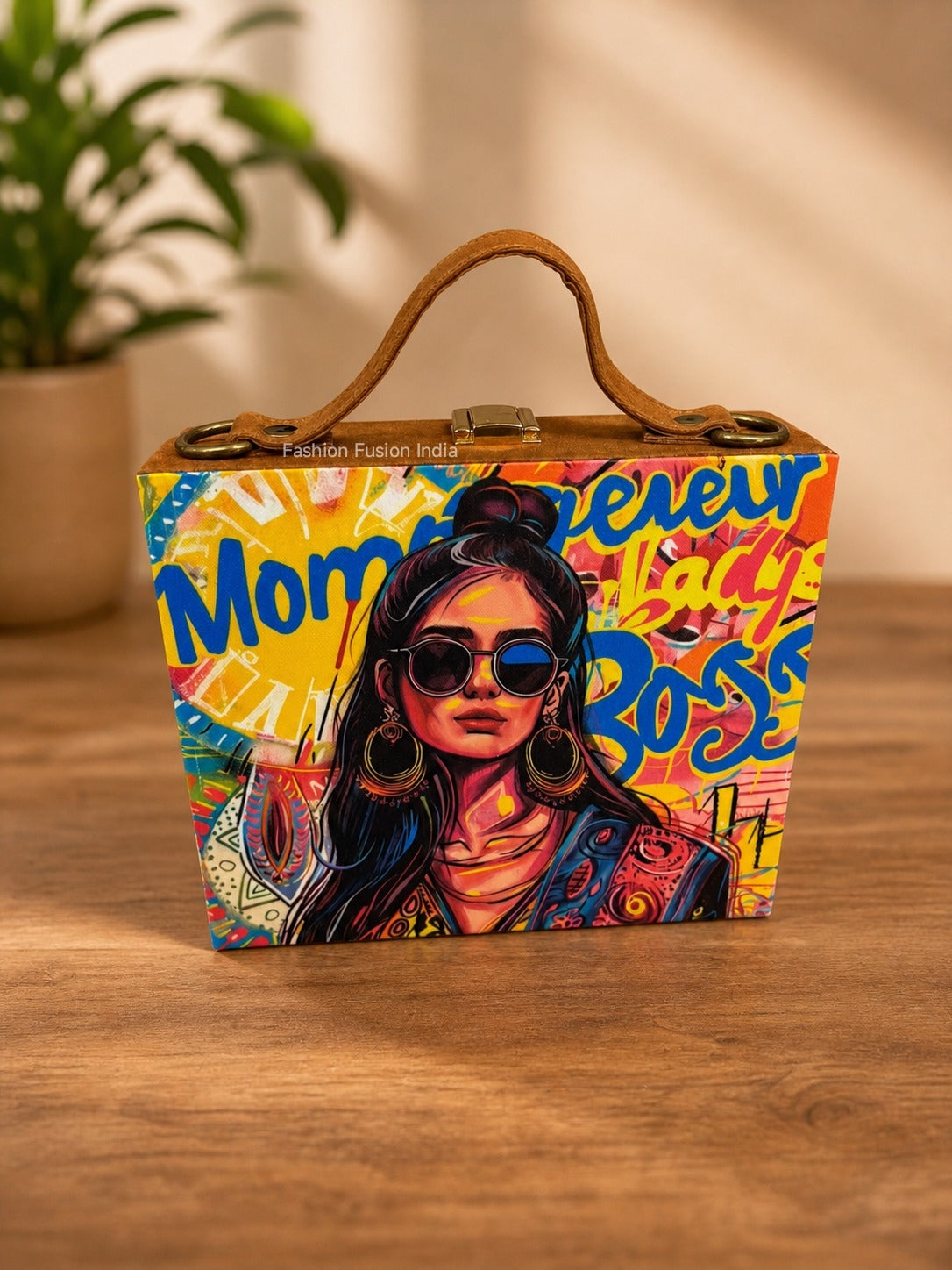 Colorful pop-art wooden clutch bag with stylish woman illustration on warm indoor background.