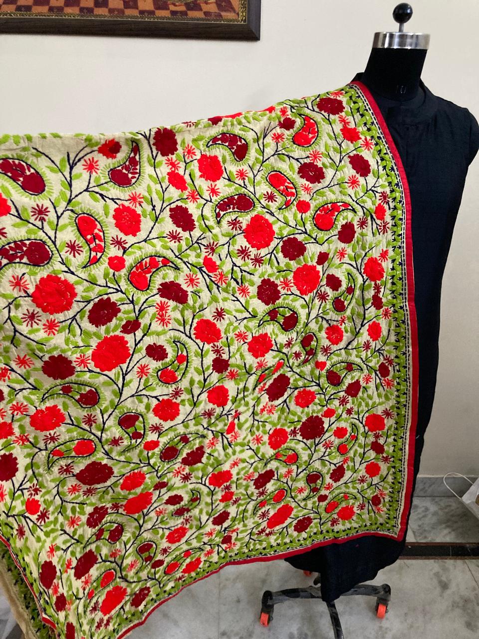 Floral patterned fabric draped over a mannequin with a neutral background