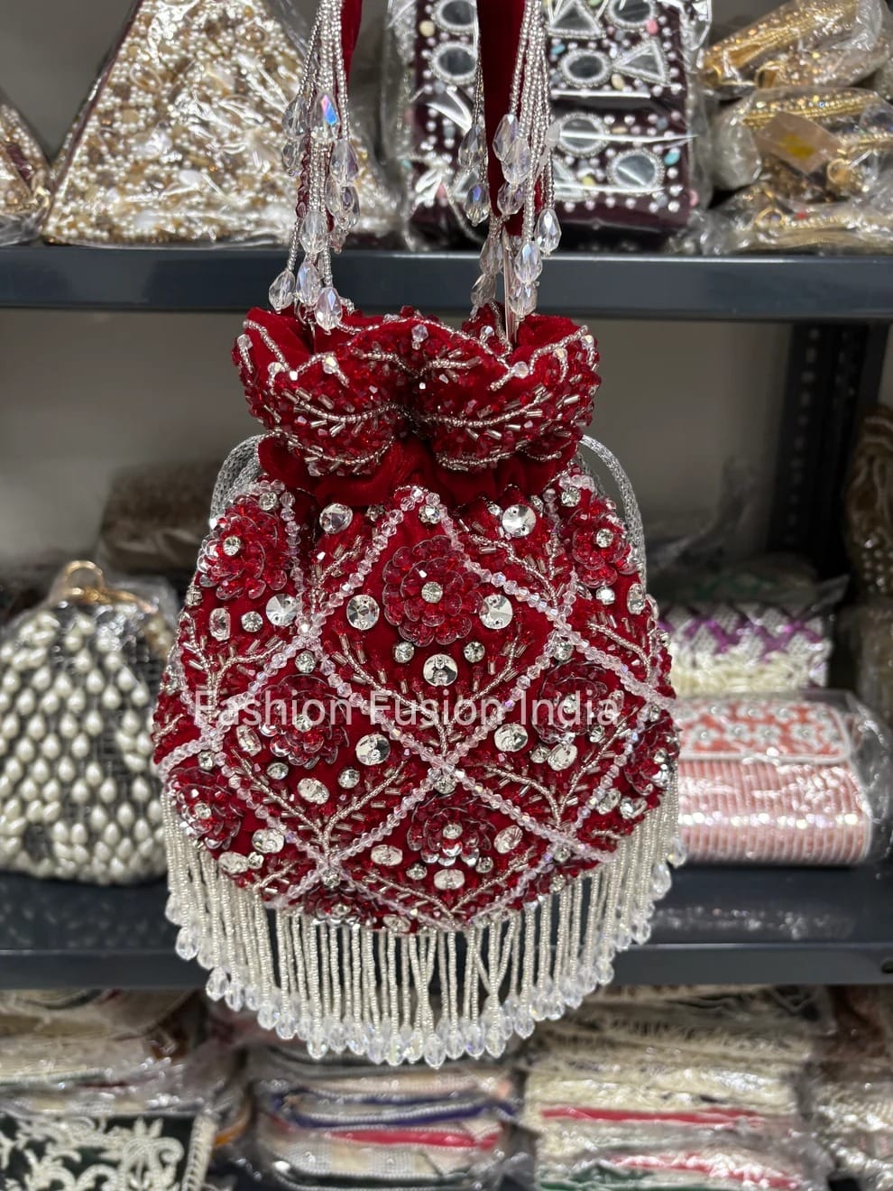 Red beaded handbag with tassels on a blurred background