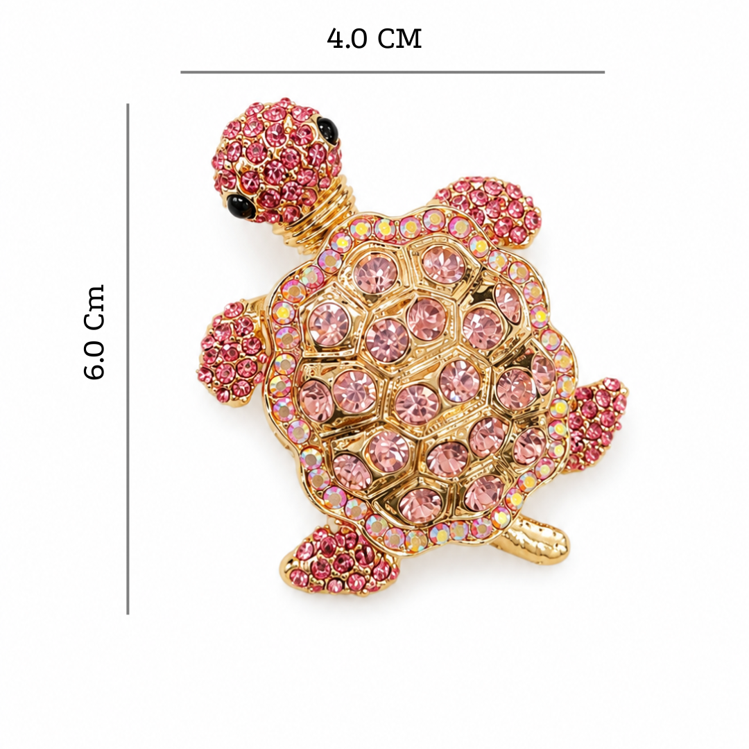 Pink turtle-shaped jewelry box with crystal details and measurements on a white background