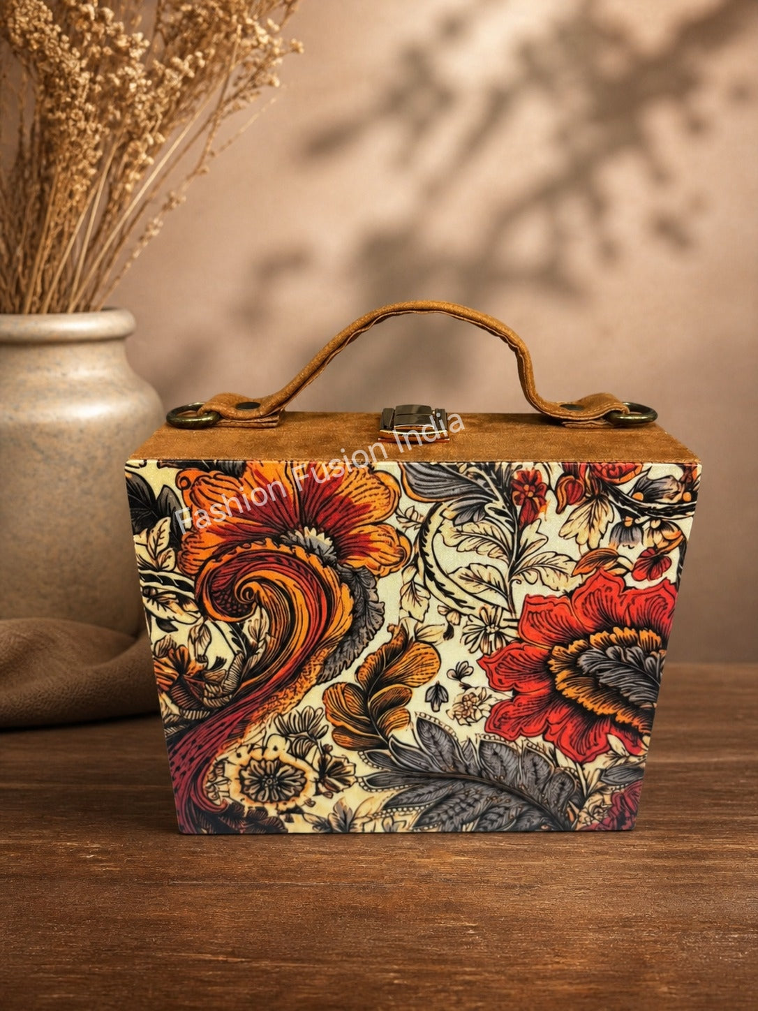 Vintage floral wooden clutch bag with ornate botanical artwork on warm beige background.