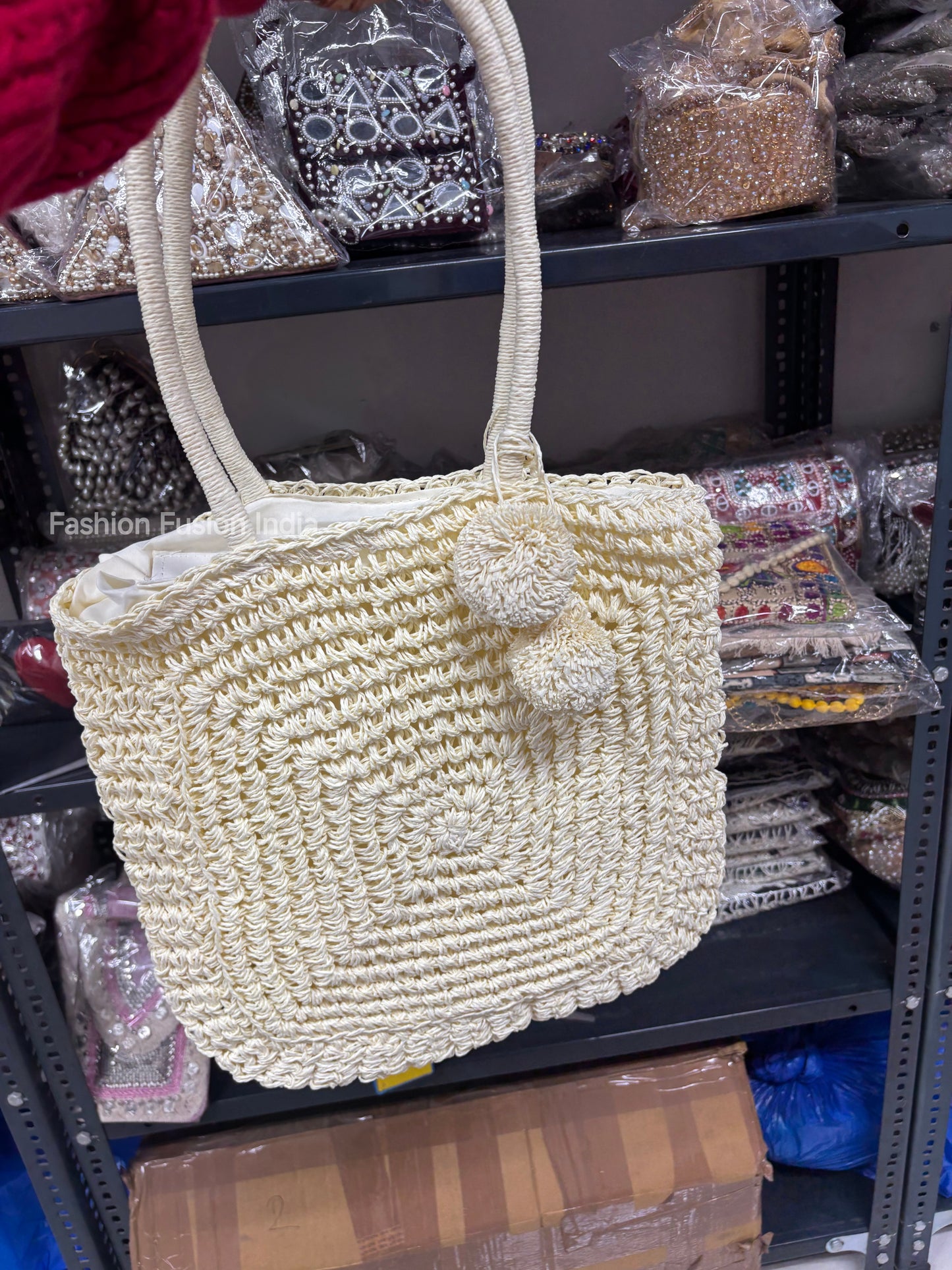 Cream crochet tote bag with pom-pom charm, handcrafted straw shoulder bag with sturdy handles