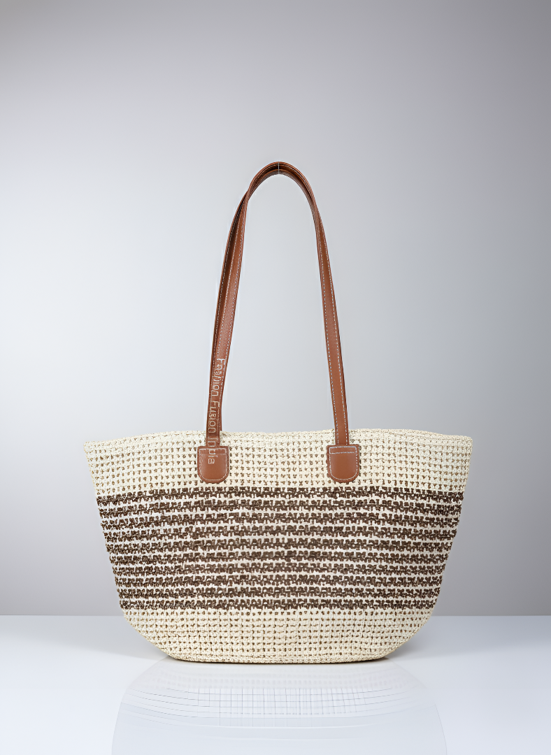 Woven straw bag with brown handles on a light gray background