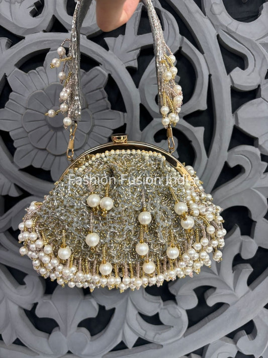 Decorative handbag with pearls against a decorative background