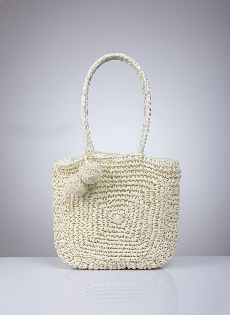 Cream handwoven crochet tote bag with round pattern, handmade straw shoulder bag with pom-pom detail